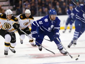 Phil Kessel breaks away from a pair of Bruins on Wednesday night at the ACC. Kessel scored two goals as the Leafs romped 6-1. (CRAIG ROBERTSON, Toronto Sun)