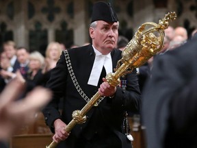 Sergeant-at-arms Kevin Vickers is applauded in the House of Commons in Ottawa on October 23, 2014. (REUTERS/Chris Wattie)