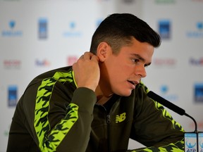 Canada's Milos Raonic speaks during a press conference to announce his withdrawal due to an injury from the ATP World Tour Finals tennis tournament in London on November 13, 2014. (AFP PHOTO/GLYN KIRK)