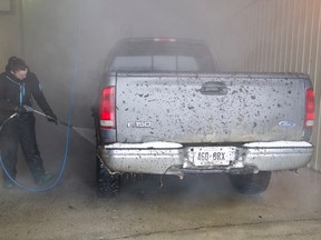 essica McWhirter washes a truck at the U-Clean Car Wash during Saturday's car wash fundraiser for Richard Solomon who was diagnosed with cancer this past August. The car wash was being held by the staff of the Cochrane CIBC where Richard wife Ashely works and the staff of the U-Clean Car Wash. As a way to raise funds to help the Solomon family with expenses incurred during his chemotherapy treatments he is receiving in Sudbury.