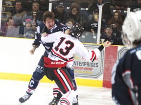 Cochrane Crunch defenceman Ned Simpson, left, and Soo Thunderbirds forward Boris Katchouk trade haymakers in the third-period of the Thunderbirds' dominant 4-0 win on Friday at the Tim Horton Event Centre.