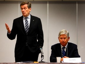 Mayor-elect John Tory speaks beside Case Ootes, chairman of the transition team, during the opening remarks of his transition council meeting on Thursday Nov. 13, 2014. (DAVE ABEL/Toronto Sun)