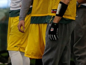 Injured Edmonton Eskimos quarterback Mike Reilly (right) talks to newly signed quarterback Justin Goltz talk during the team practise at the Commonwealth Stadium field house on Wednesday Nov. 12, 2014. The Eskimos play the Saskatchewan Roughriders in the Western Semi-Final on Sunday in Edmonton. Tom Braid/Edmonton Sun/QMI Agency