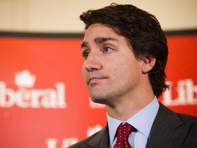 Liberal Party leader, Justin Trudeau makes an announcement regarding the 2014 economic update during a press conference in Vancouver, British Columbia November 12, 2014. (REUTERS/Ben Nelms)
