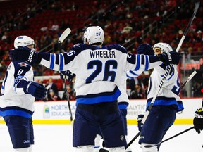 The Jets celebrate Blake Wheelers first goal of the hockey game in Thursday's 3-1 win over the Carolina Hurricanes.