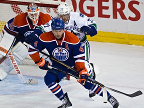Oilers forward Taylor Hall injured his right knee Nov. 1 when he crashed into the net in a game against the Vancouver Canucks. (Codie McLachlan, Edmonton Sun)