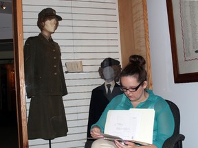 Emily McKenzie works on her new book, The Proudest Girl in Canada, about Elgin women who served in the Second World War. It launches Saturday at Elgin Military Museum. (Contributed photo)