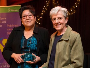 Darlene Ritchie of Atlohsa Native Family Healing Services and Sue Wilson of the Sisters of St. Joseph display the John Robinson Awards they received at a ceremony Thursday at the London Music Club.  (CRAIG GLOVER, The London Free Press)
