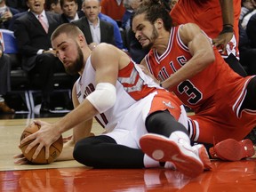 Raptors' Jonas Valanciunas battles Joakim Noah of the Chicago Bulls on Nov. 13. (Craig Robertson, Toronto Sun)