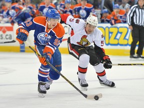 Edmonton Oilers center Ryan Nugent-Hopkins (93) is chased on a breakaway by Ottawa Senators defenceman Cody Ceci (5) at Rexall Place Thursday night. ( Steve Alkok-USA TODAY Sports)