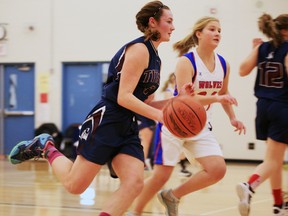 St. Theresa Catholic Secondary School Titans (blue jersey) earned a 32-18 win over the Cobourg Collegiate Institute Wolves in semi-final COSSA AA junior action at the Belleville, Ont. high school Thursday, Nov. 13, 2014. - JEROME LESSARD/THE INTELLIGENCER/QMI AGENCY