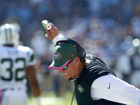 New York Jets head coach Rex Ryan slams a cup of water down during the second quarter against the San Diego Chargers at Qualcomm Stadium on Oct 5, 2014 in San Diego, CA, USA. (Jake Roth/USA TODAY Sports)