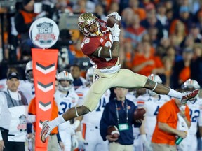 Florida State Seminoles P.J. Williams intercepts an Auburn Tigers pass in the fourth quarter during the NCAA BCS Championship football game in Pasadena, California January 6, 2014. (REUTERS/Mike Blake)