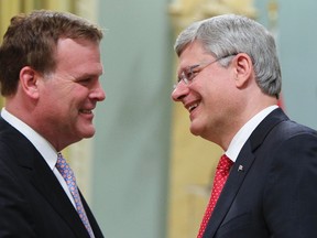 Foreign minister John Baird (left) and Prime Minister Stephen Harper. (QMI Agency)