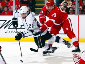 Los Angeles Kings defenceman Alec Martinez scores while being defended by Detroit Red Wings centre Gustav Nyquist (14) in the second period at Joe Louis Arena. (Rick Osentoski/USA TODAY Sports)