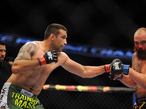 Fabricio Werdum (red gloves) fights Travis Browne (blue gloves) before their heavyweight fight during UFC on FOX 11 at Amway Center on April 19, 2014. (David Manning/USA TODAY Sports)