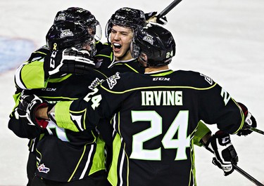 Edmonton's (from left) Chance Patterson, Tyler Robertson, Mads Eller and Aaron Irving celebrate Robertson's goal during the Edmonton Oil Kings' WHL hockey game against the Saskatoon Blades at Rexall Place in Edmonton, Alta., on Friday, Nov. 14, 2014. Codie McLachlan/Edmonton Sun/QMI Agency