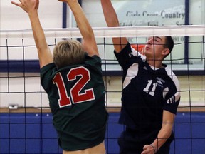 Parkside Collegiate Institute Stampeders Owen Henderson prepares to lob the ball over the net in their 'AA' WOSSAA Jr. Boys' volleyball semifinal match against the Stratford Central Rams at Ingersoll District Collegiate Institute on Friday. Parkside won three sets to two and defeated South Collegiate Institute three sets to none in the finals to win WOSSAA 'AA' gold. (GREG COLGAN, QMI Agency)
