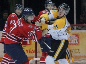 A first-period fight broke out between Stephen Desrocher of the Oshawa Generals and Connor Schlichting of the Sarnia Sting. Desrocher later scored the game-winning goal for the Generals. (TERRY BRIDGE, The Observer)
