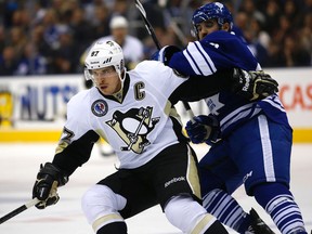 Maple Leafs' Nazem Kadri battles Sidney Crosby of the Pittsburgh Penguins on Nov. 14, 2014. (Craig Robertson, Toronto Sun)