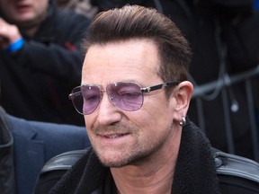 U2 lead singer Bono arrives for the recording of the Band Aid 30 charity single in west London Nov. 15, 2014.   REUTERS/Neil Hall