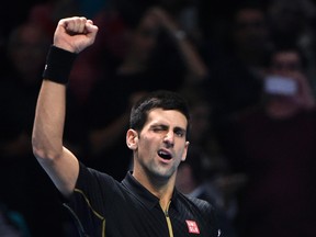 Novak Djokovic reacts after winning his semifinal match against Kei Nishikori at the ATP World Tour Finals at the O2 Arena in London November 15, 2014. (REUTERS/Toby Melville)