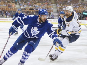 The Leafs' Nazem Kadri and Sabres' Nick Petrecki during at the Air Canada Centre on Sept. 28, 2014.( Ernest Doroszuk/Toronto Sun)
