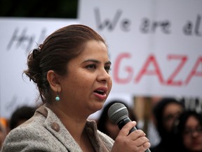 Saima Jamal reads an apology for the violence at the previous pro-Palestinian rally at a second rally held at city hall in Calgary, Alta., on Friday July 25, 2014. (Mike Drew/QMI Agency)