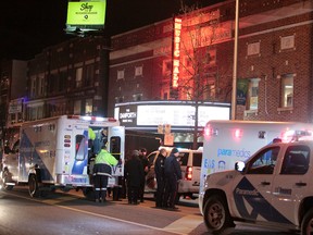 Emergency services at the scene on Danforth Ave. early Sunday, Nov. 16, 2014, after four people were injured in an attack. One man has been arrested. (John Hanley/Special to the Toronto Sun)