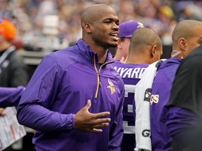 Minnesota Vikings running back Adrian Peterson (28) talks on the sidelines during the first quarter against the Philadelphia Eagles in Minneapolis, Minnesota in this file photo from December 14, 2013. (REUTERS)