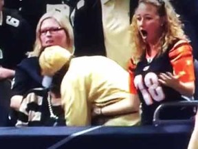 Bengals fan Christa Barrett wasn't please after a Saints fan intercepted a ball intended for her in the stands.