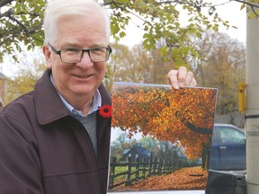 Environment Canada Meteorologist David Phillips shows off the 24th edition of The Canadian Weather Trivia Calendar Nov. 3, 2011. Since he created it three decades ago, it’s become the best-selling calendar in Canada.