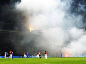 Croatia's supporters throw flares onto the field during their Euro 2016 qualifying soccer match against Italy at the San Siro stadium in Milan November 16, 2014.  (REUTERS)