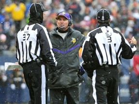 Head coach Mike Zimmer of the Minnesota Vikings talks to the officials during the first quarter of a game against the Chicago Bears at Soldier Field on November 16, 2014 in Chicago, Illinois. (David Banks/Getty Images/AFP)