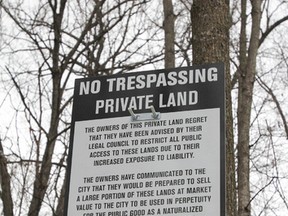 Public access is now restricted to a popular wooded area along Taylor Kidd Boulevard, just past Collins Bay Road, according to this sign on Sunday. (Julia McKay/The Whig-Standard)