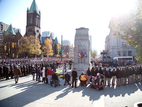 More than 10,000 people attended the Remembrance Day ceremony at the cenotaph  in London, Ontario on Tuesday, November 11, 2014. (DEREK RUTTAN, The London Free Press)