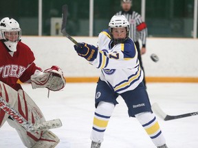 Laurentian Voyageurs' Emma Leger keeps her eye on the puck in front of the York goaltender during OUA women's hockey action at Gerry McCrory Countryside Arena on Sunday afternoon.