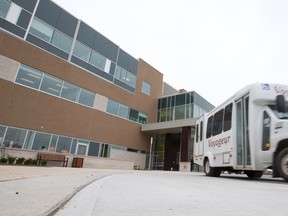 A bus pulls away from Parkwood Institute?s mental health building after moving some of the 150 patients from the Highbury Ave. site. (CRAIG GLOVER, The London Free Press)