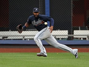 Atlanta Braves right fielder Jason Heyward (22) fields a ball hit by New York Mets first baseman Lucas Duda during the first inning at Citi Field.  (Adam Hunger/USA TODAY Sports)