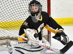 Kody Eisler, goalie with the Mitchell Atoms, makes a save to help the Meteors claim the Aylmer tournament championship this past weekend. JEFF LOCKHART PHOTO