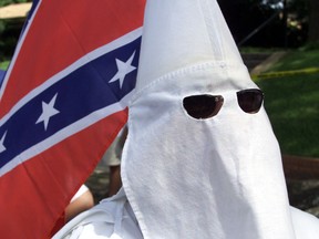 Ku Klux Klan members approach the Walls Unit in Huntsville, Texas in this file photo.