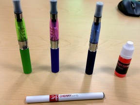 Examples of e-cigarettes are displayed at a news conference at the Edmonton Clinic Health Academy, 11405 87 Ave NW, in Edmonton, AB on Monday, November 17, 2014. The Student Advocates for Public Health (SAPH) are calling for city council to amend the current smoking bylaw to include e-cigarettes  TREVOR ROBB/EDMONTON SUN