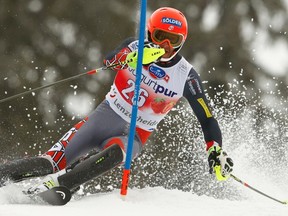 Bode Miller of the U.S. clears a pole during the first run of the men's slalom competition at the FIS Alpine Skiing World Cup Finals in Lenzerheide March 16, 2014. (REUTERS/Ruben Sprich)
