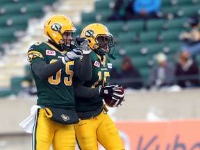 Eskimos LB Rennie Curran, left, shown here celebrating an interception with teammate Chris Rwabukamba in Sunday's game, predicts the West final's outcome will come down to four or five plays. (Perry Mah, Edmonton Sun)