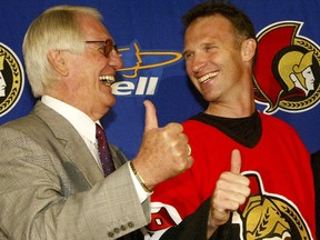 Former Sens GM John Muckler and goalie Dominik Hasek in 2004. (Ottawa Sun Files)