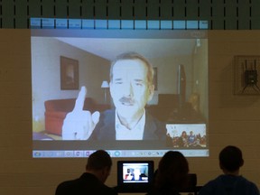 Retired Canadian astronaut Col. Chris Hadfield talks to pupils at St. Marguerite Bourgeoys Catholic School in Kingston on Monday, Nov. 21, 2014.