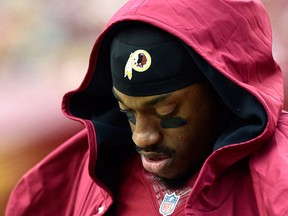 Quarterback Robert Griffin III of the Washington Redskins looks on in the second half of a game against the Tampa Bay Buccaneers at FedExField on November 16, 2014 in Landover, Maryland. (Patrick McDermott/Getty Images/AFP)