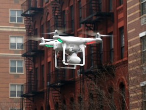 A camera drone flown by a cameraman flies near the scene where two buildings were destroyed in an explosion, in the East Harlem section in New York City, in this file photo taken March 12, 2014. REUTERS/Mike Segar/Files