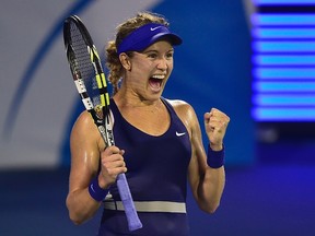 Eugenie Bouchard celebrates after winning her women's singles semifinal against Caroline Wozniacki at the Wuhan Open in Wuhan, Hubei province September 26, 2014. (REUTERS/China Daily)