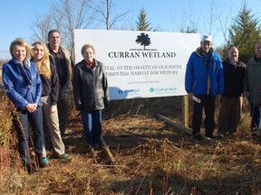 Members of the Curran family look forward to seeing the full results of the rehabilitation of a marginal piece of farmland they own just east of Thamesville. From left, Suzanne, Brooke, Brent, Iona and Bill Curran, Chatham- Kent employee Jeff Bray and councillor Steve Pinsonneault.